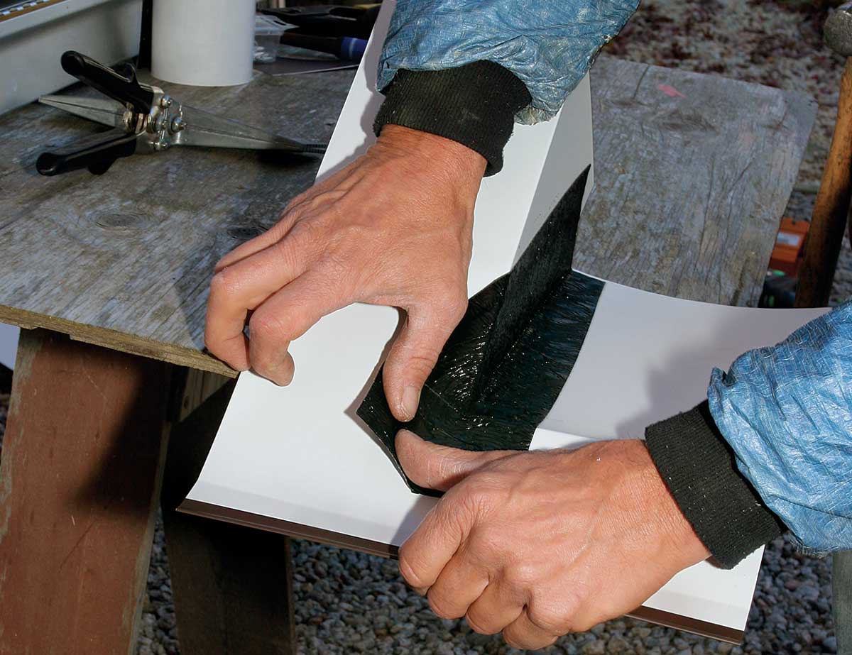 Seal the back. With metals that can be soldered, the solder seals the joint against water. Aluminum can’t be soldered, so apply a flexible peel-and-stick membrane to the back of the corner to seal the joint.
