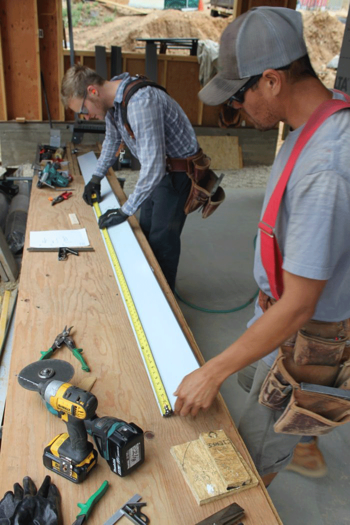 Fabricating some flashing for the windows to accommodate 4 in. of exterior insulation.