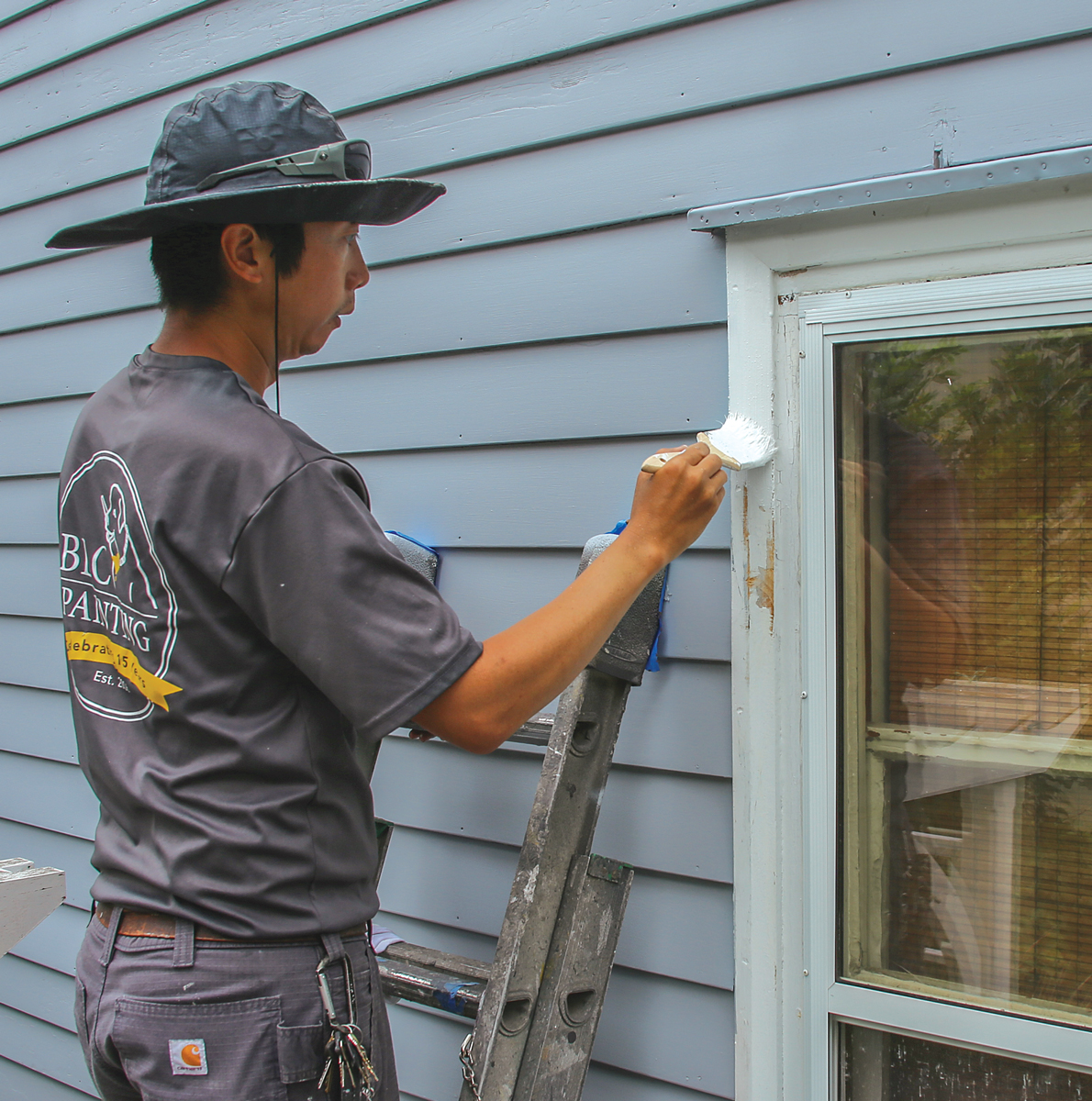 Brush or roll small sections. For trim and small sections of siding, it’s often faster to brush or roll, because less masking and surface protection is needed for brushing when you have skilled painters. My favorite brush for latex and oil paint and primers is a 2-1⁄2-in.-wide Chinex bristle brush from Corona. My favorite brush for oil-only is a Corona natural China bristle.